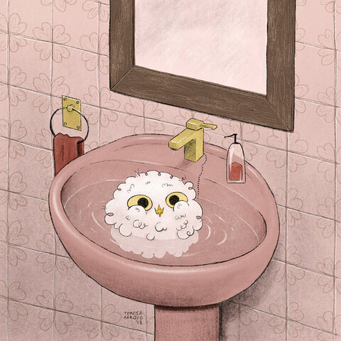 Buh the owl taking a bath in the washing basin.