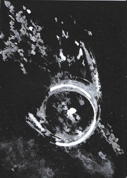 Abstract patterns in white and silver ink on black paper. In the center, the shape is looking like an unfinished circle and ink has been sprayed around.