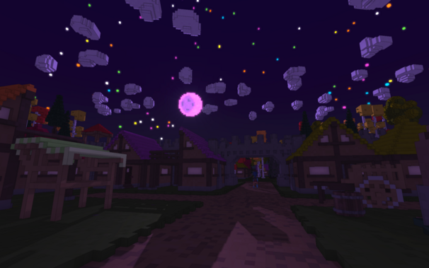 A quit village at night covered in moonlight.