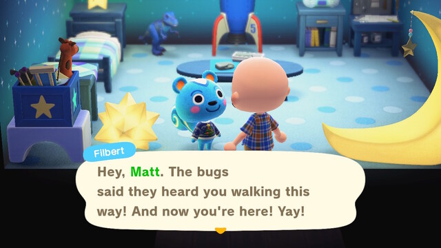 Animal Crossing: New Horizons screenshot. Image of Filbert (blur squirrel wearing a holiday sweater) talking to a bald, light skinned islander in their house. Filbert's house has an assortment of blue furniture, blue polkadot flooring, and blue starry walls. Filbert is saying, "Hey, Matt. The bugs said they heard you walking this way! And now you're here! Yay!"