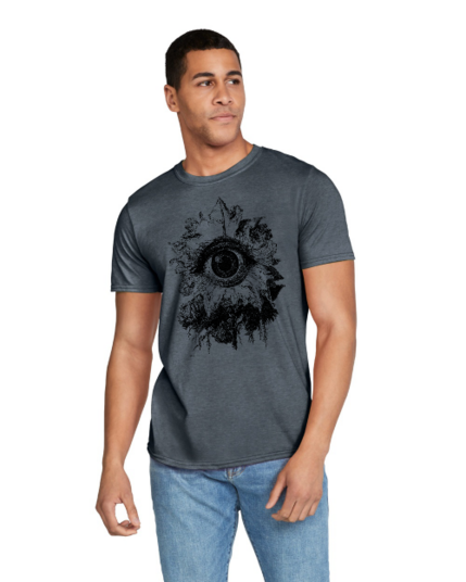 A man wearing a dark heather t-shirt depicting a surreal image of a flower with an eye in the middle of it.