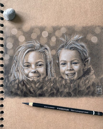 Pencil drawing of two smiling little elves, a girl and a boy, peeking from behind a hedge, made with black graphite pencils and white pencils on kraft toned paper. In the picture there are also a pencil and a putty rubber.