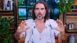Screen grab of Russell Brand gesturing with hands as he makes his statement denying charges.