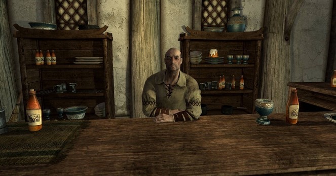 Actually a balding Skyrim NPC merchant sat behind a table.
