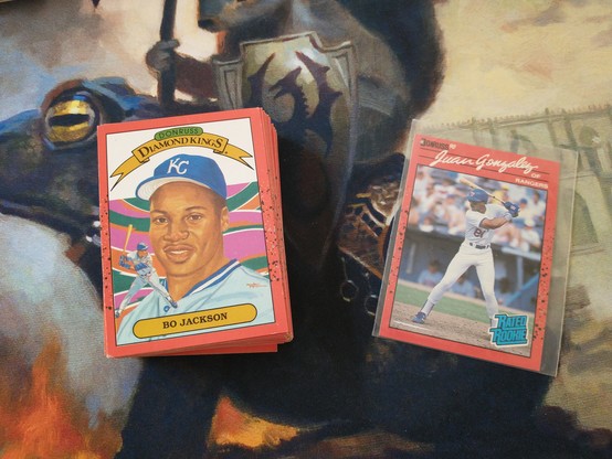 Pile of 1990 Donruss baseball cards with Bo Jackson and Juan Gonzalez showing