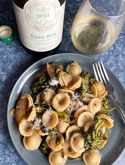 plate of orechiette with broccolini, served with a white wine.
