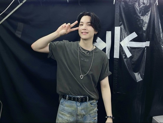 yoongi backstage of his show in his encore outfit, flashing a victory sign and a cute smile