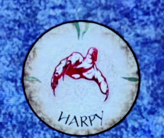 The Harpy token from Blood on the Clocktower. The image is supposed to look like an evil hand reaching for you, but is also similar to a hair piece.