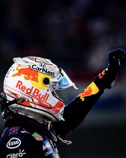 Max Verstappen raises an arm in celebration at the first ever Qatar Grand Prix