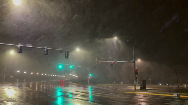 Video showing winter weather conditions in Missoula, Montana including blowing snow and moderate snowfall.
