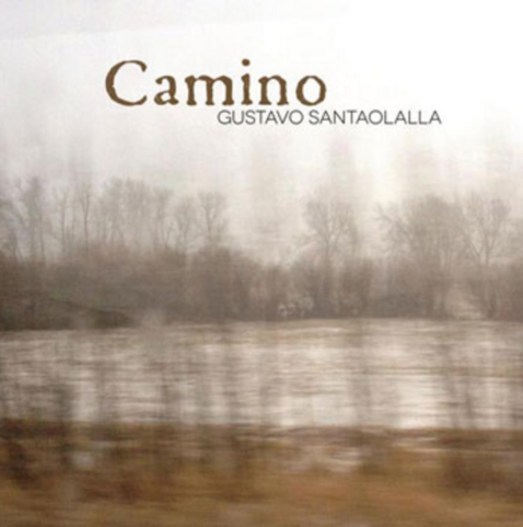 Album cover, a blurry photo maybe taken out of a moving vehicle, from a wintery lanscape