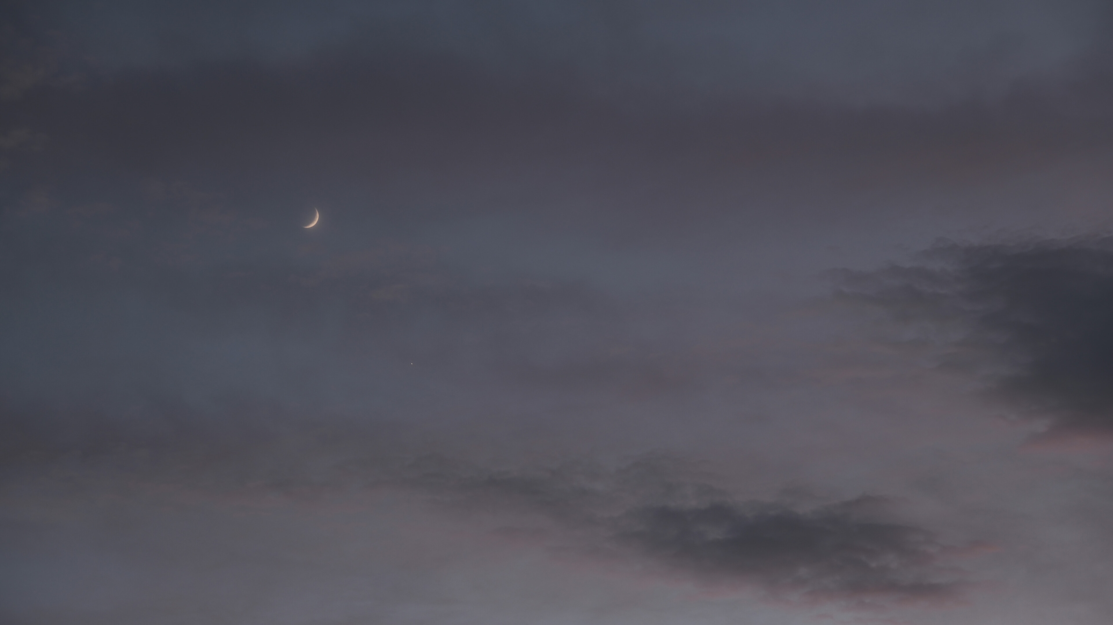 Moon and Venus through hazy clouds