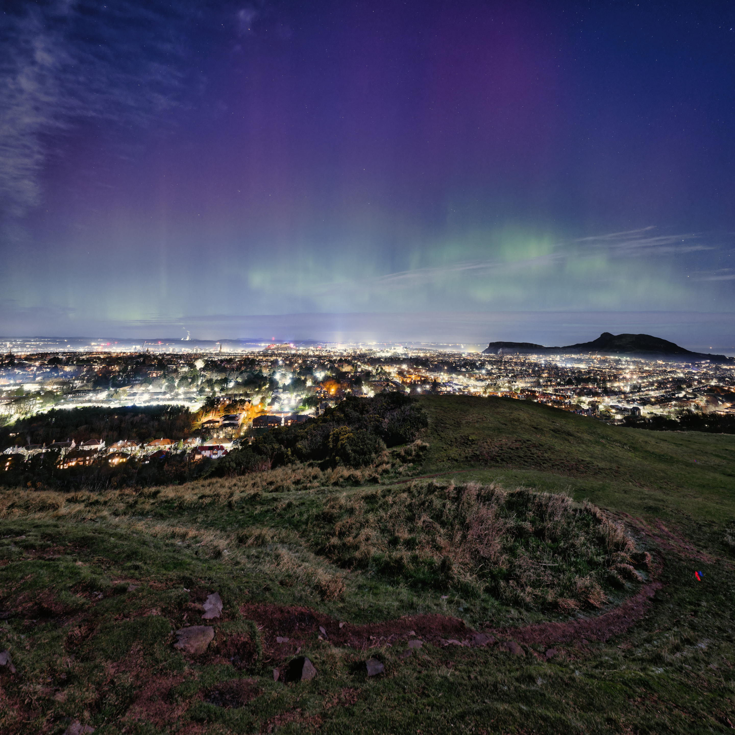 An aurora bright enough to outshine the full moon over the City of Edinburgh, taken from the trig-point up Blackford Hill near the Observatory