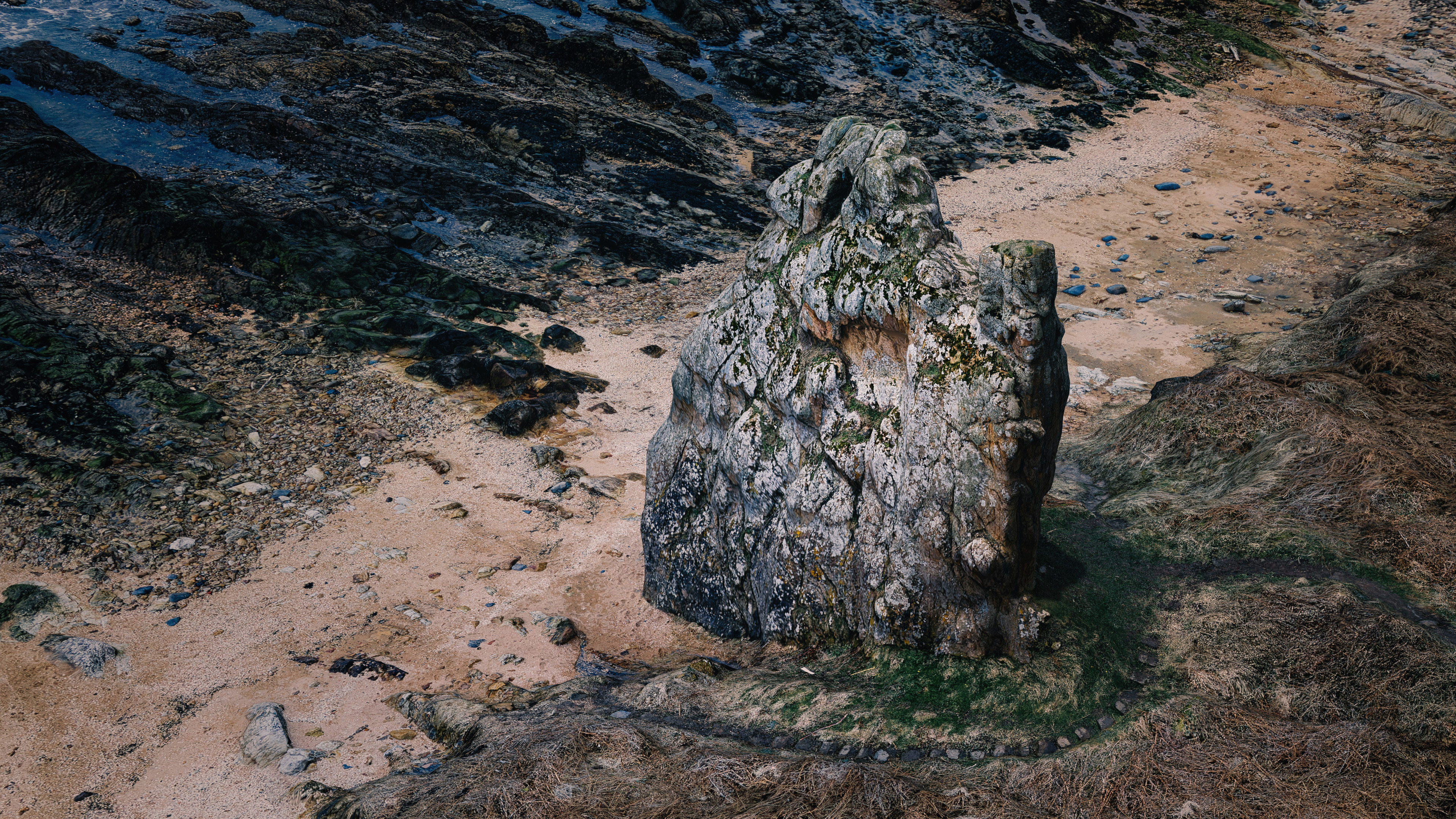 A 3D model from 2.2Gpx of data showing the Maiden Rock sandstone seastack outside St Andrews, Scotland, relit and rendered in Blender and finished in LuminarAI.