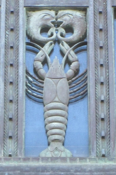 Art deco style architectural building detail depicting a crawfish