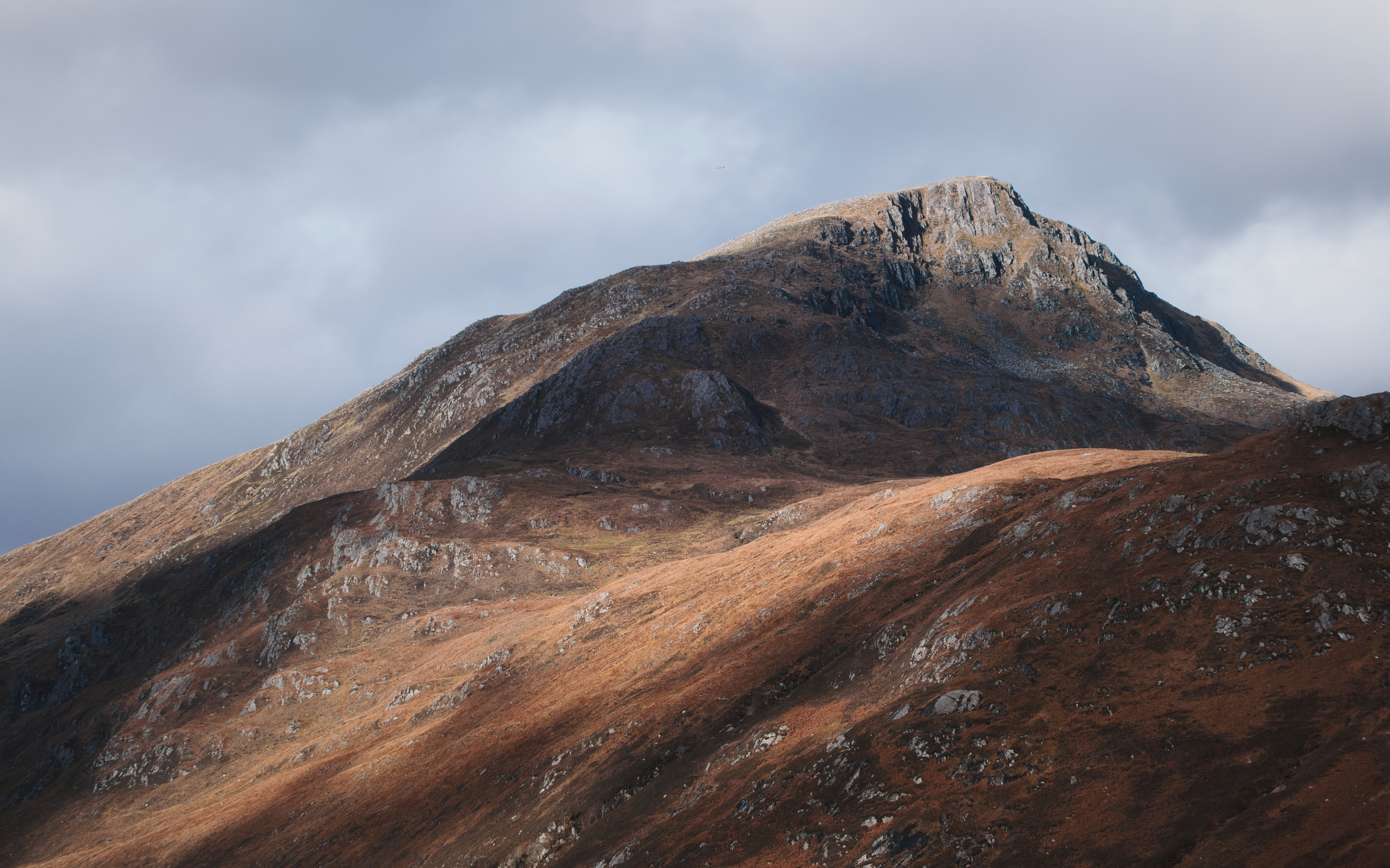 Sunlight and darker cloud shadows on the slopes of Sgurr na Lapaich, Glen Affric