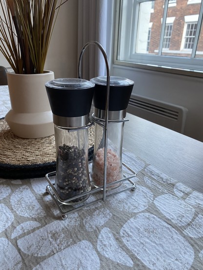 A salt and pepper mill holder with handle. I always seem to lose one or the other between the kitchen and dining room. Something like this would keep them together and tidy.