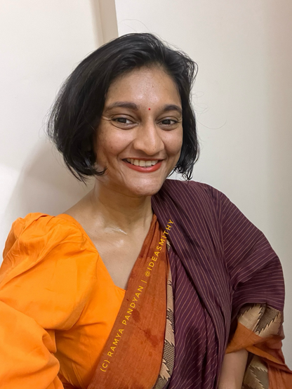 Ramya in orange blouse and maroon saree with orange border. #IWear 
