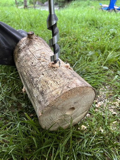 The log also gets holes in its sides using the auger drill