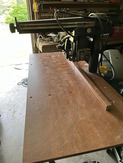 An old Craftsman 12 inch radial arm saw with an old desktop added as a new Bench surface. The desk legs will be used for the back fence.