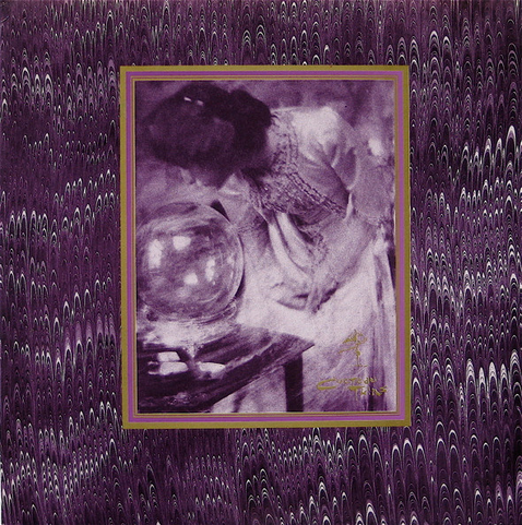 Cover of the 1984 EP The Spangle Maker by The Cocteau Twins that featured the song Pearly Dewdrops Drops. The image shows a woman dressed in elaborate old-fashioned clothing leaning over a glass sphere