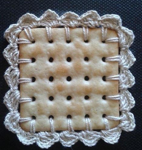 square saltine cracker with lace embroidered edge — artist unknown
