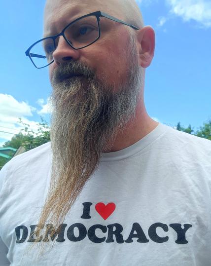 Just a sad looking weird-beard wearing a shirt that says, 
