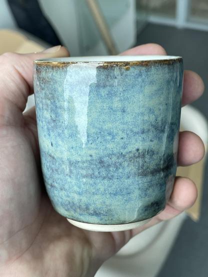Another small beaker, glazed in a cyan/blue that breaks to a rusty brown at the rim. This is my favourite.