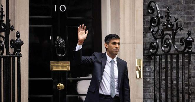 Rishi Sunak waving from Downing Street