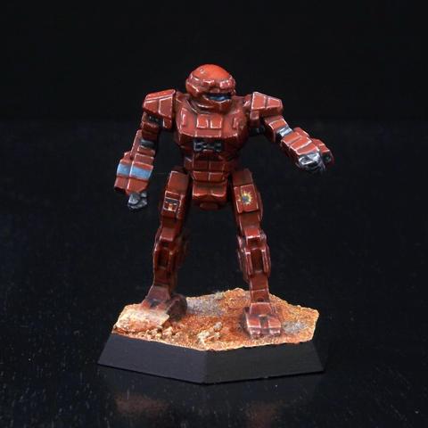 A painted miniature of a Commando 'Mech.  It is dull red with a few thin blue stripes as accents.  The emblem of the DMM is on the right leg, and the Federated Commonwealth emblem is on the left leg.