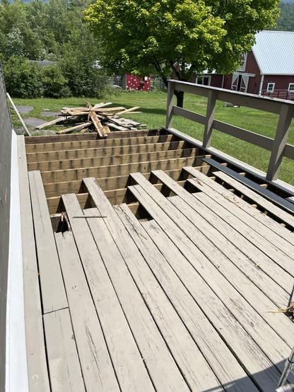 Deck with a section of boards removed.