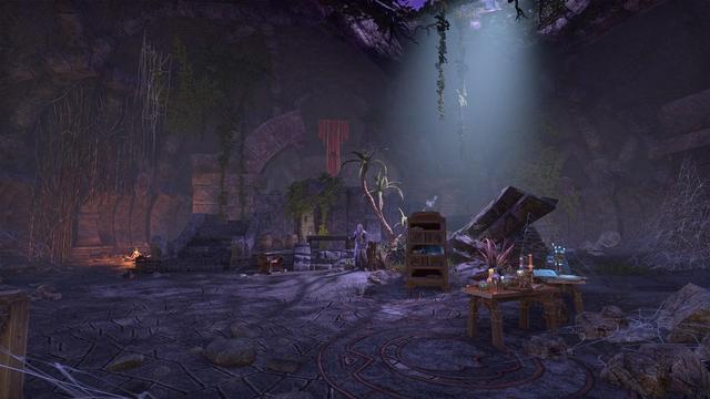 Screenshot of The Harborage, a location from Elder Scrolls Online. Dark stone ruins overgrown with foliage, and one robed figure standing in the center of the frame.