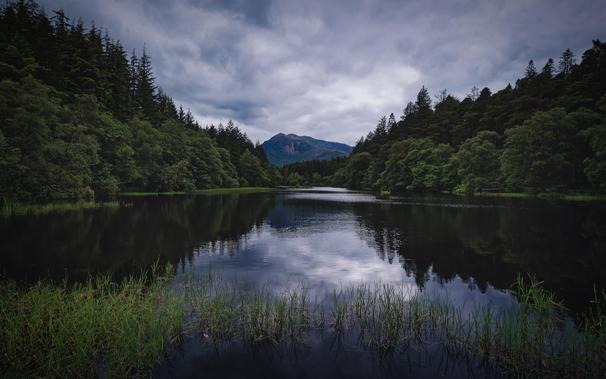 Conventional view of Glencoe Lochan with clouds reflected in the water