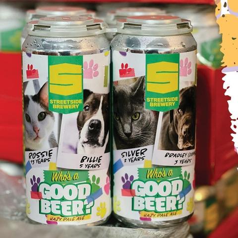 Cans of Who’s a Good Beer from Streetside Brewery in Cincinnati. Cans feature photos of shelter cats and dogs from Save the Animals Foundation.