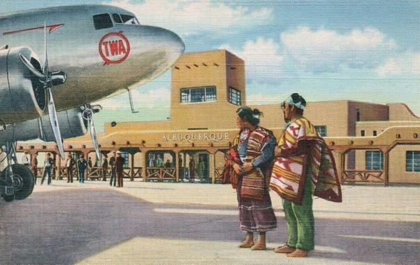 Albuquerque Aiport with a TWA dc-3 and two Native People greating visitors. 