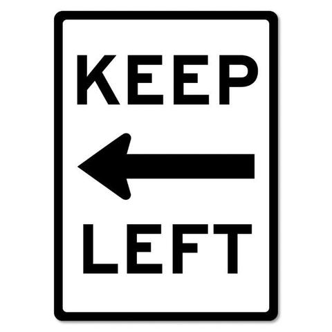 Black and white rectangular sign reading keep left, with an arrow pointing left in the center 