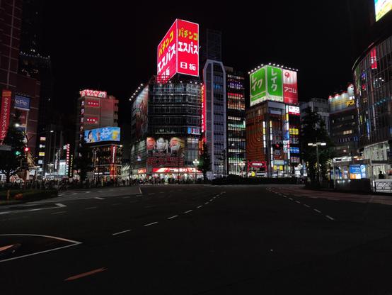 An intersection in Tokyo at night.