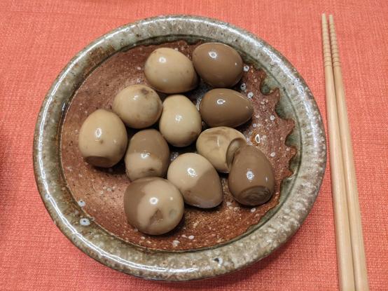 A bowl with soy marinated quail eggs
