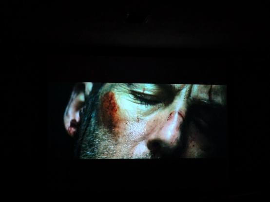 Opening shot of the movie with a close up of a man's face - nose, cheek and closed eye, with a red bruise on the cheek