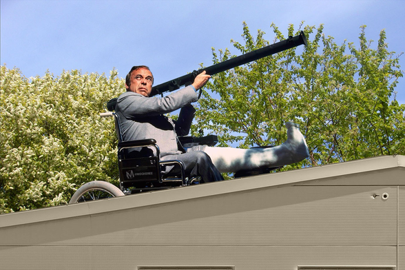 Herbert Lom as Chief Inspector Dreyfus, Inspector Clouseau’s deranged nemesis, wielding a bazooka on top of a beige warehouse roof 