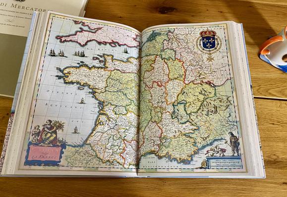 The colors, the design, the mapped inaccuracies! It's all super shiny. The inside of the book, obviously focused on France.