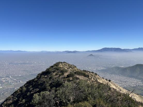 panoramic view of santiago covered with heavy smog from Cerro El Carbon 