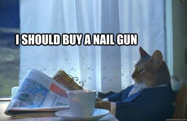 Cat in suit, sitting at table with newspapers and a cup of coffee

Text: I should buy a nail gun