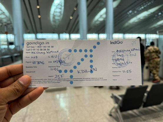 Ticket in Indian airport with handmade marking for flight and gate/boarding details
