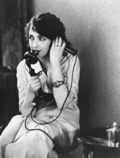 Image of lady on vintage phone