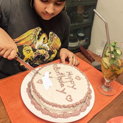Kid cutting a cake