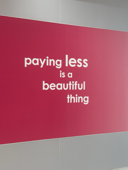 Advertisement proclaiming that ‘paying less is a beautiful thing’