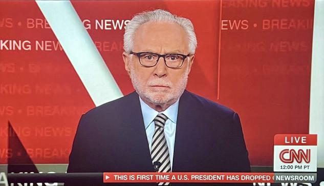 Wolf Blitzer looking unenthusiastic about reporting on President Biden dropping out of the 2024 Presidential Election race