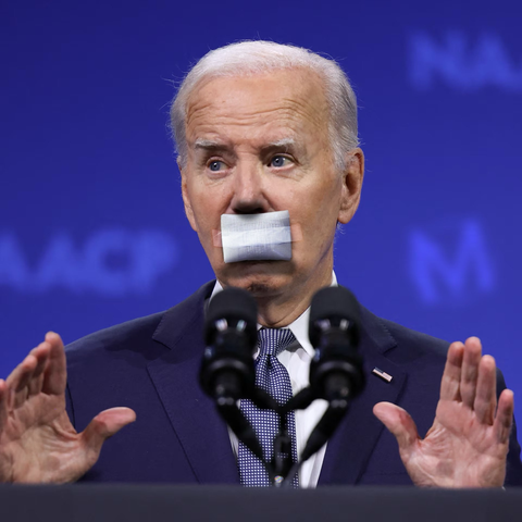 Joe Biden looking startled, hands raised, with a wadded white bandage taped across his mouth like the one previously seen on Trump’s ear. Because it *is* the one previously seen on Trump’s ear.