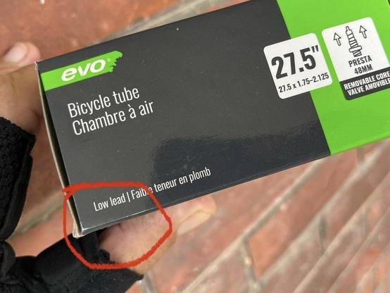 Bicycle tube package of green and black with ‘low lead’ printed on the side. 